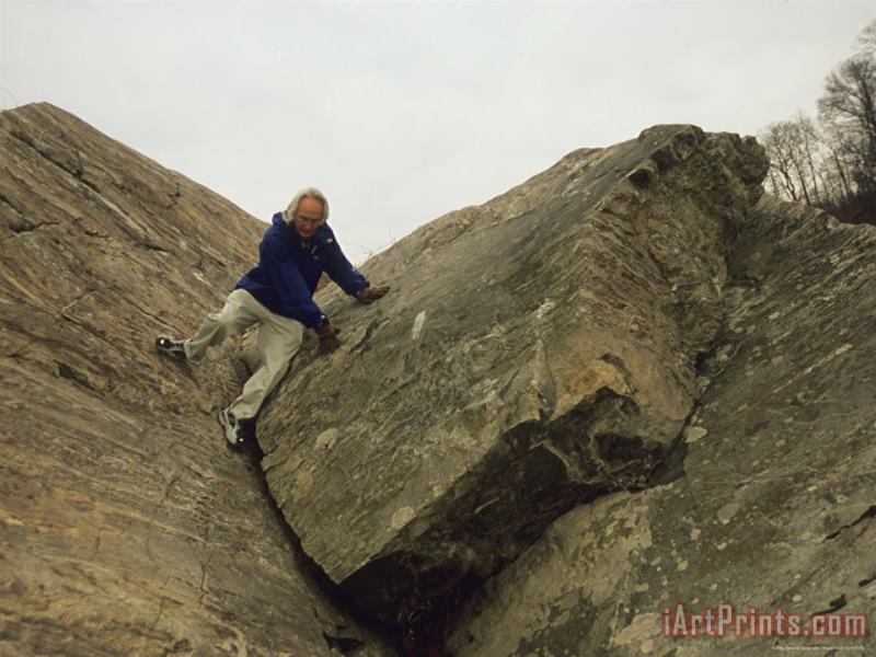 Raymond Gehman A Hiker Descends a Rock Formation on Great Falls Billy Goat Trail Art Print