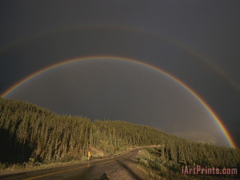 Raymond Gehman A Rainbow Arches Over The Alaska Highway in British Columbia Canada Art Print
