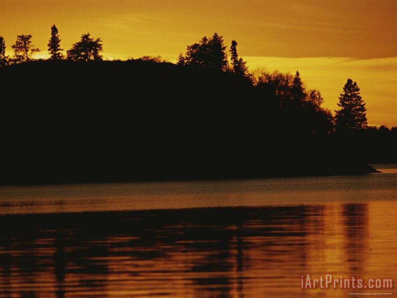 Raymond Gehman A Twilight View of a Lake And a Silhouette of a Tree Covered Mountain Art Print