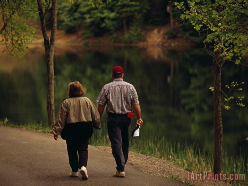Raymond Gehman Couple Walking by The Water Along a Park Road Art Painting