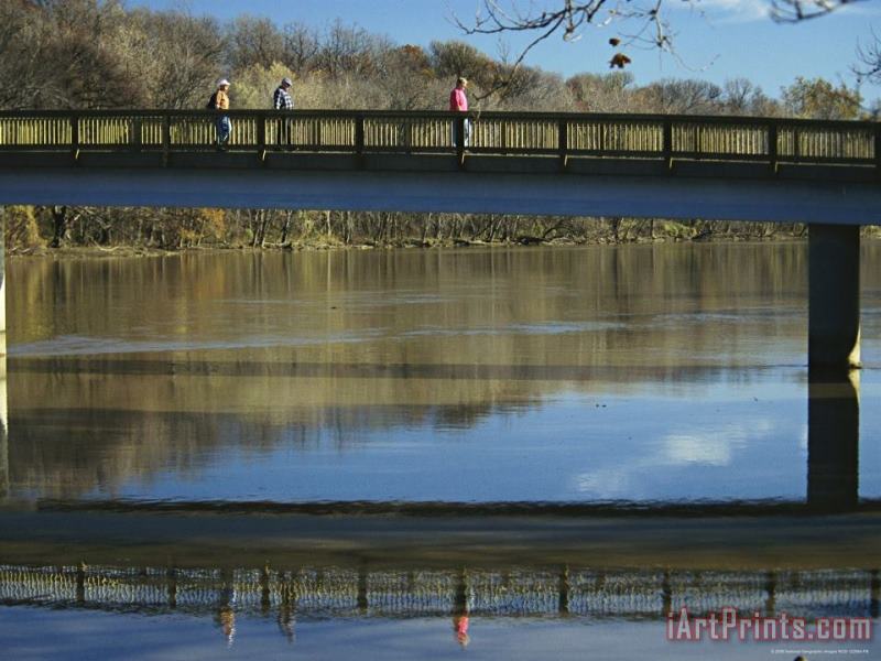 Raymond Gehman Three Men Cross a Footbridge Between Rosslyn And The Potomac River Art Print