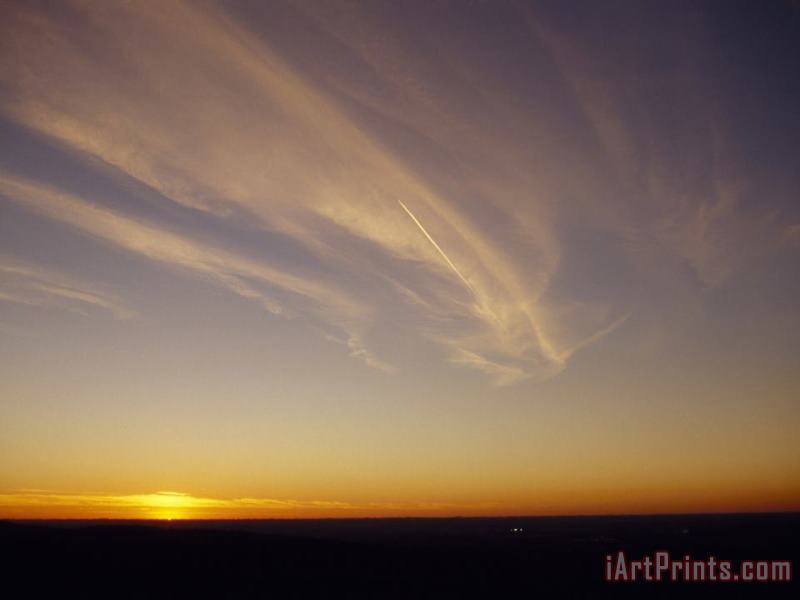 Raymond Gehman Wispy Clouds And Jet Vapor Trail in The Sky at Sunset Art Print