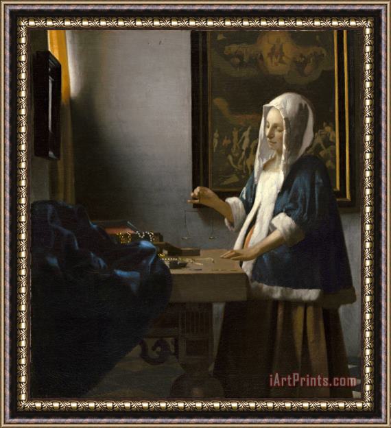 Jan Vermeer Woman Holding a Balance Framed Print