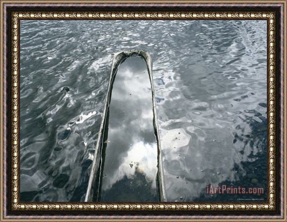 Raymond Gehman A Log Canoe Is Submerged Into Otsego Lake Framed Painting