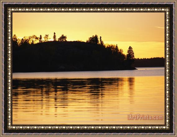 Raymond Gehman The Setting Sun Casts a Golden Glow Over Manitoba's White Lake Framed Print