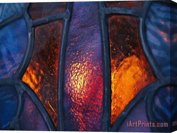 Raymond Gehman Sunset Illuminates a Stained Glass Window of a Church Stretched Canvas Painting / Canvas Art