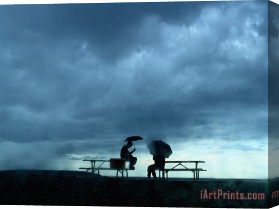 Raymond Gehman Tourists Sit on Picnic Tables While Waiting Out a Storm Stretched Canvas Print / Canvas Art