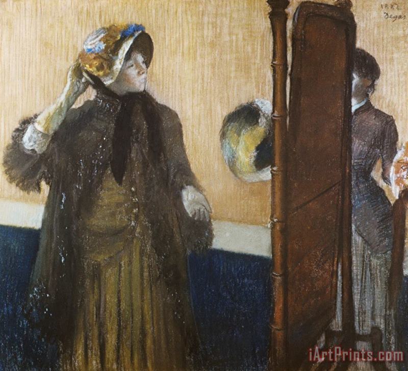 At The Milliner's painting - Edgar Degas At The Milliner's Art Print