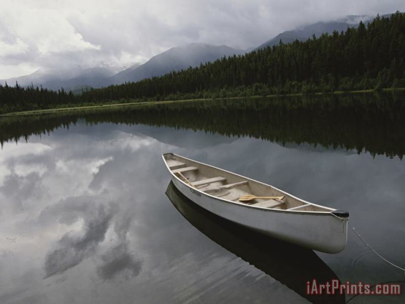 Raymond Gehman A Canoe Sits Tethered to Shore on a Beautiful Mountain Lake Art Painting