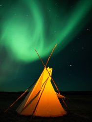 Raymond Gehman A Solitary Tepee Is Illuminated by The Aurora Borealis