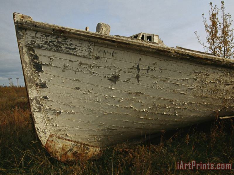 A Wooden Boat Lies Abandoned at The Hay River Shipyard painting - Raymond Gehman A Wooden Boat Lies Abandoned at The Hay River Shipyard Art Print