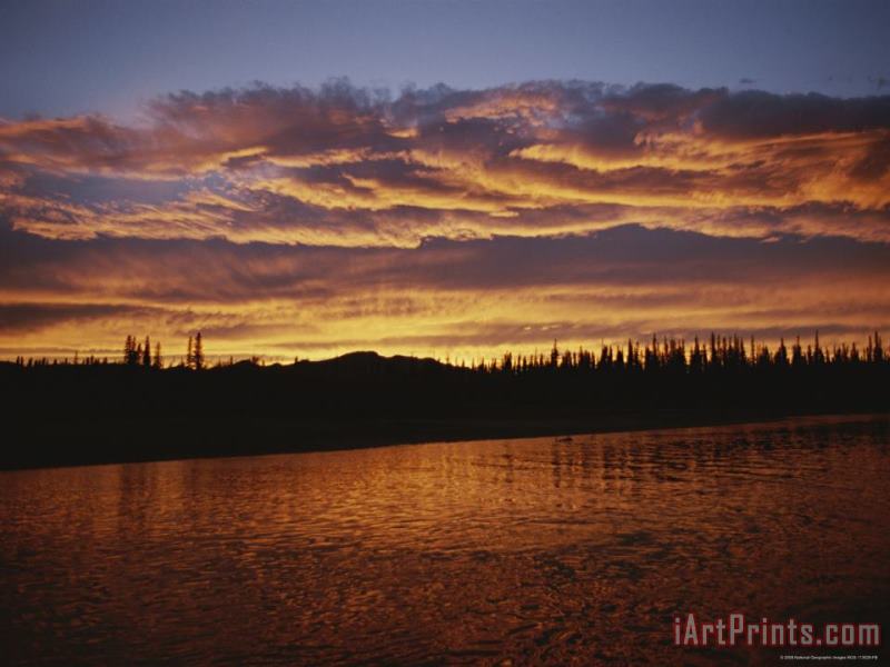 Raymond Gehman An Intense Sunset Colors Clouds And The Water of The Mackenzie River Art Print
