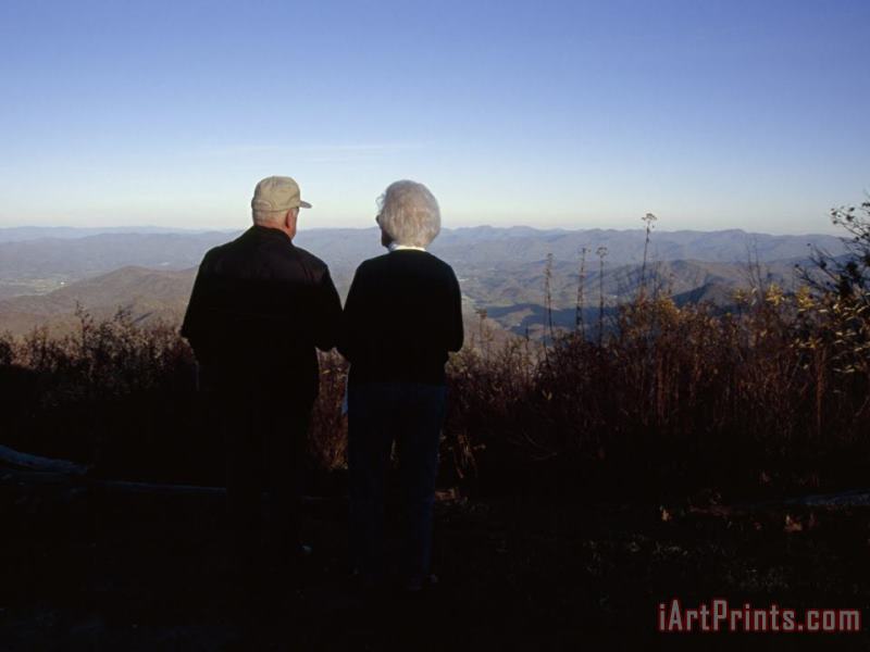 Raymond Gehman An Old Couple Taking in a Scenic View From Wayah Bald at Dusk Art Print
