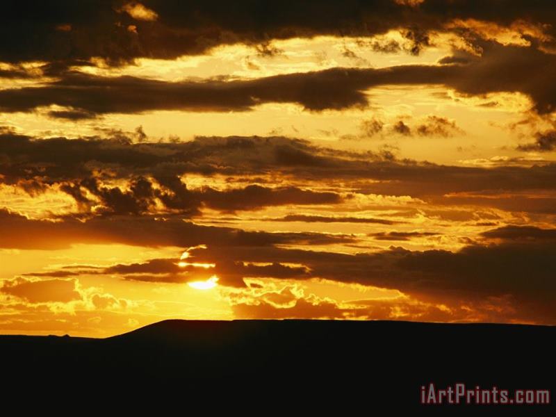 Raymond Gehman Clouds Are Colored Shades of Orange by The Low Sun Over 70 Mile Butte Art Print