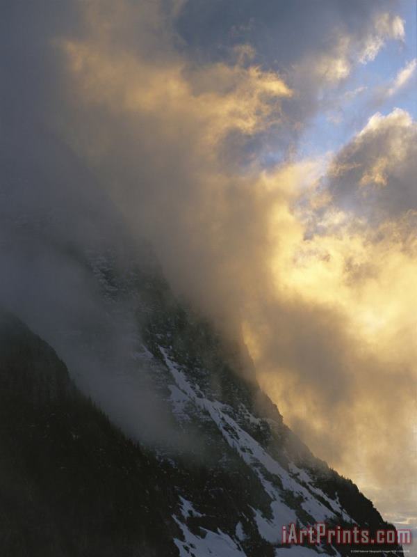 Clouds Obscure Mount Oberlin Along The Logan Pass painting - Raymond Gehman Clouds Obscure Mount Oberlin Along The Logan Pass Art Print