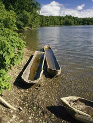 Raymond Gehman Log Canoes on The Banks of a Recreated Iroquois Fishing Camp