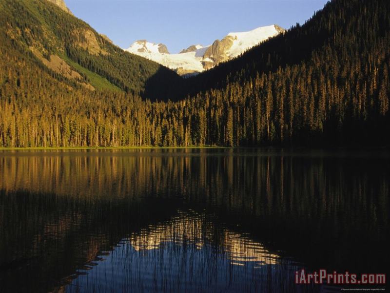 Raymond Gehman Snow Capped Mountains Reflect in a Lake Art Print