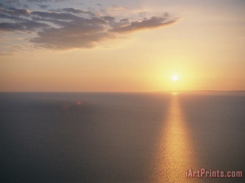 The Sun Sets Over Lake Superior painting - Raymond Gehman The Sun Sets Over Lake Superior Art Print