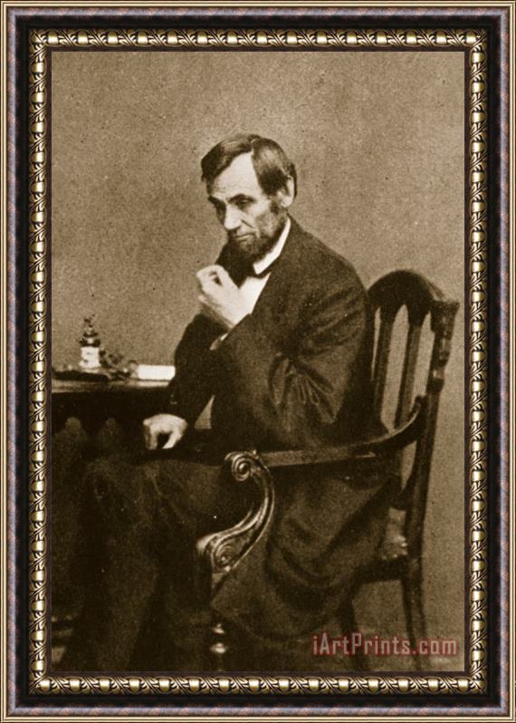 Mathew Brady Abraham Lincoln Sitting At Desk Framed Print