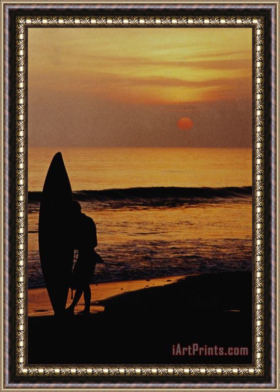Others Surfing At Sunset Framed Print