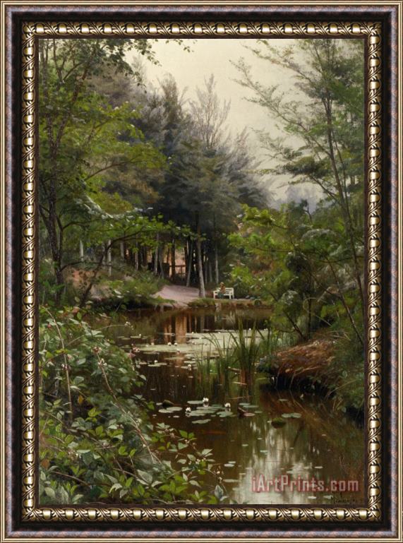 Peder Mork Monsted A Lady Reading by a Lake Framed Print