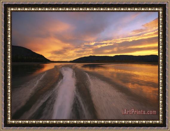 Raymond Gehman A Jet Boat Leaves a Wake in The Mackenzie River at Sunset Framed Print