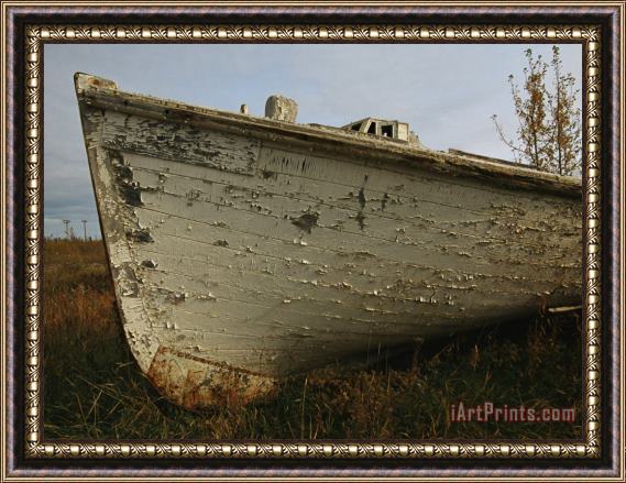 Raymond Gehman A Wooden Boat Lies Abandoned at The Hay River Shipyard Framed Print