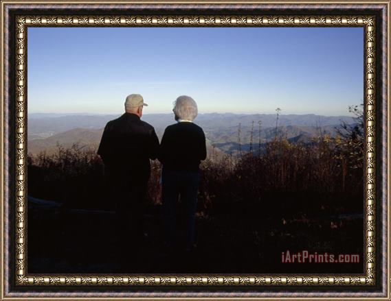 Raymond Gehman An Old Couple Taking in a Scenic View From Wayah Bald at Dusk Framed Print