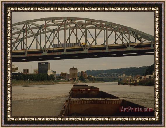 Raymond Gehman Coal Barge Passing Under a Bridge on an American River Framed Print