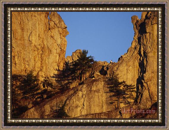 Raymond Gehman Hiker Near The Top of a 900 Foot High Seneca Rocks Framed Painting