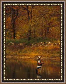 Fishing Boats in a Calm Sea Framed Prints - Man Standing in Calm Water Trying His Luck Fishing by Raymond Gehman