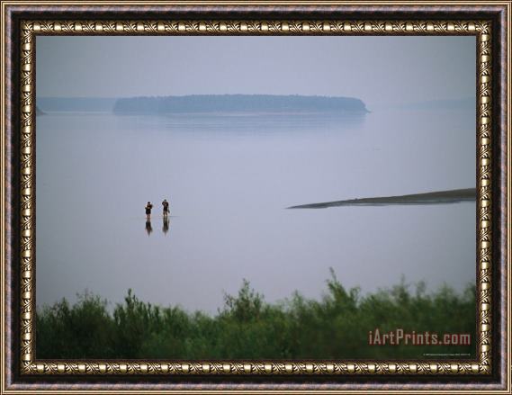 Raymond Gehman Mist Rises From The Mackenzie River As Two People Go Wading Framed Print