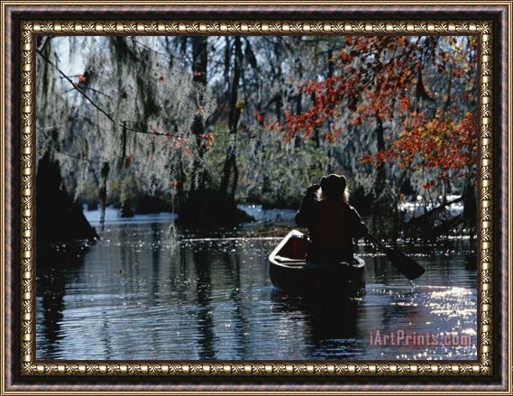 Raymond Gehman Park Ranger Canoeing Under Cypress Trees Draped with Spanish Moss Framed Print