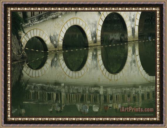 Raymond Gehman Reflections of a Gracefully Arched Bridge in Calm Water Framed Print