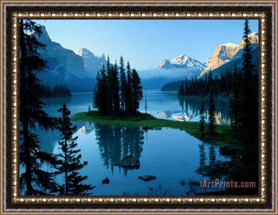 Raymond Gehman Scenic View of The Lake Surrounded by Evergreens And Snow Capped Mountains Framed Print