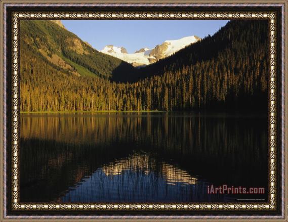 Raymond Gehman Snow Capped Mountains Reflect in a Lake Framed Painting
