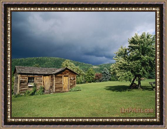 Raymond Gehman Storm Clouds Form Above a Log Cabin on The Site of French Azilum Framed Print