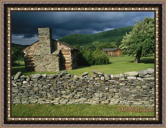 Raymond Gehman Storm Clouds Form Above Log Buildings on The Site of French Azilum Framed Print