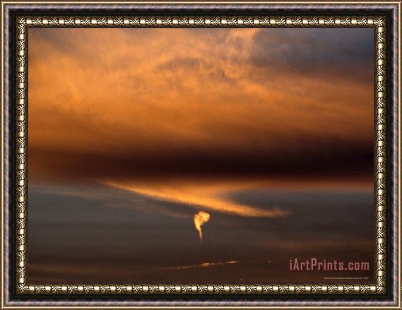 Raymond Gehman Strange Comma Like Cloud Formation at Sunset Framed Painting