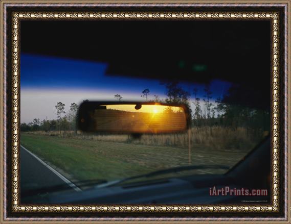 Raymond Gehman Sunrise Appears in a Drivers Rear View Mirror Framed Painting