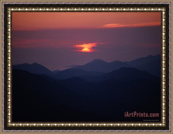 Raymond Gehman Sunrise Over a Silhouetted Range of Mountains Framed Print