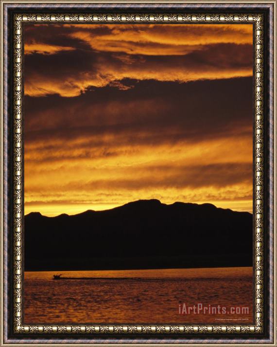 Raymond Gehman Sunset Is Reflected in The Mackenzie River at Camsell Bend Framed Print
