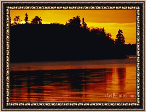 Raymond Gehman The Setting Sun Casts an Orange Glow Over Manitoba's White Lake Framed Painting