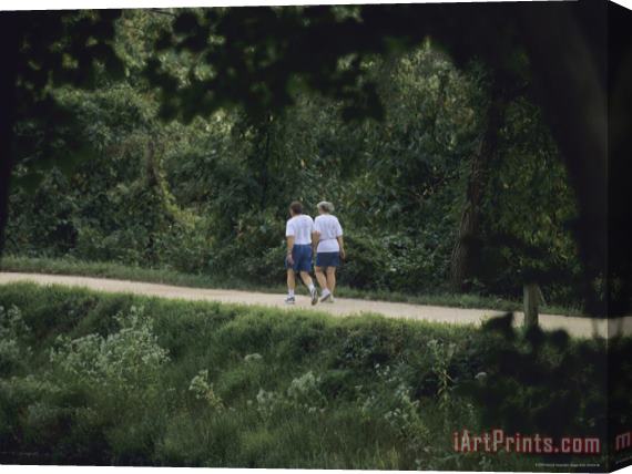 Raymond Gehman A Couple Walks on The Towpath of The Chesapeake And Ohio Canal Stretched Canvas Print / Canvas Art