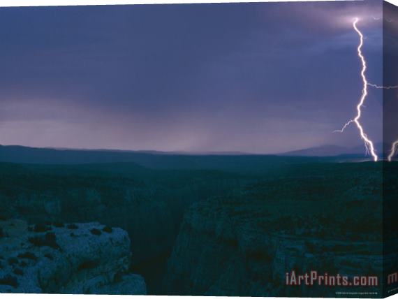 Raymond Gehman A View of a Lightning Strike Over Bighorn Canyon National Recreation Area Stretched Canvas Print / Canvas Art