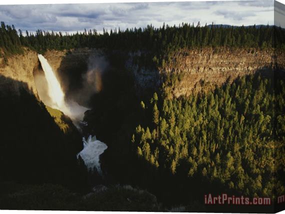Raymond Gehman A Waterfall Spills Into a Deep Canyon Surrounded by Forest Stretched Canvas Print / Canvas Art