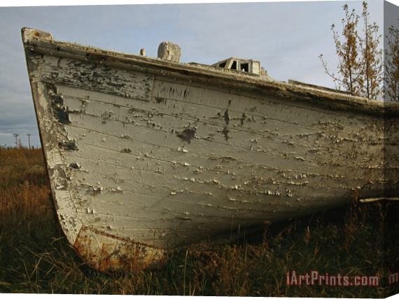 Raymond Gehman A Wooden Boat Lies Abandoned at The Hay River Shipyard Stretched Canvas Print / Canvas Art