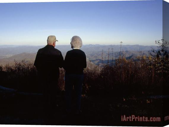 Raymond Gehman An Old Couple Taking in a Scenic View From Wayah Bald at Dusk Stretched Canvas Painting / Canvas Art