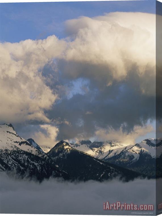 Raymond Gehman Clouds Hover Above And Below Heavens Peak Stretched Canvas Print / Canvas Art