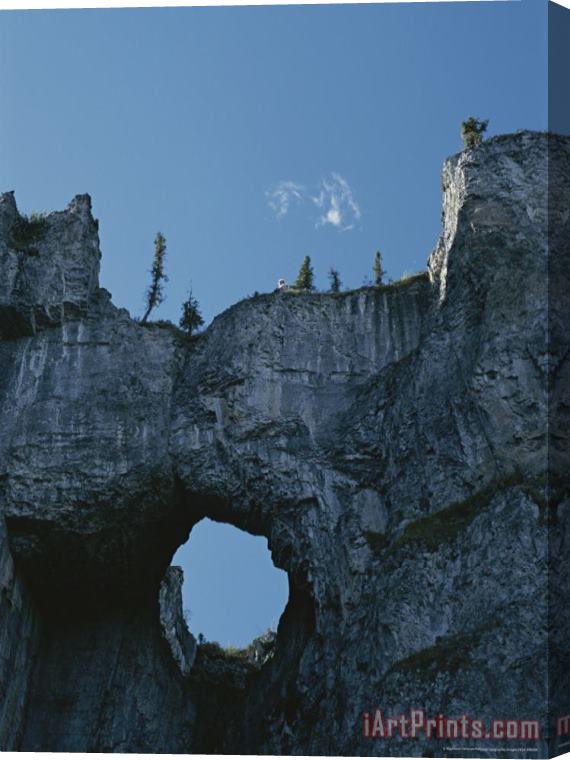 Raymond Gehman Erosion Carves a Window Into Limestone Rock in Nahanni National Park Stretched Canvas Painting / Canvas Art